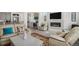 Inviting living room showcasing a fireplace, modern decor, and an open layout into the kitchen at 4108 N Quatar Ct, Aurora, CO 80019