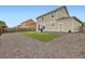 Wide shot of a large backyard with low maintenance landscaping and a privacy fence at 56579 E 23Rd Pl, Strasburg, CO 80136