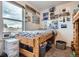 Comfortable bedroom with natural light, carpeted floors, and a twin-size bed at 56579 E 23Rd Pl, Strasburg, CO 80136