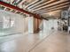 Unfinished basement space with exposed ceiling, concrete floor and roughed-in plumbing at 4773 Kittredge St, Denver, CO 80239