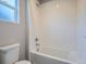 Bright bathroom featuring a shower over tub with white subway tile and crisp, clean lines at 4773 Kittredge St, Denver, CO 80239