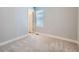 A bedroom featuring plush carpet flooring and a window at 4773 Kittredge St, Denver, CO 80239