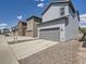 Street view of houses with landscaped yards and concrete driveways at 4773 Kittredge St, Denver, CO 80239