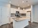 Modern kitchen featuring white cabinetry, granite countertops, and stainless steel appliances at 4773 Kittredge St, Denver, CO 80239