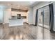 Open concept kitchen with stainless appliances, granite counters and hardwood floors at 4773 Kittredge St, Denver, CO 80239