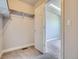 A well-organized walk-in closet with carpet flooring and a clothing rack at 4773 Kittredge St, Denver, CO 80239