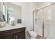 Modern bathroom featuring a glass-enclosed shower, vanity with sink, and toilet at 303 Rogers Ct, Castle Rock, CO 80104
