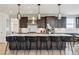 Spacious kitchen with a large center island, pendant lighting, and modern appliances at 303 Rogers Ct, Castle Rock, CO 80104