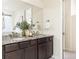 Bathroom featuring double vanity, granite countertop, and modern fixtures at 757 Cabot Dr, Erie, CO 80516