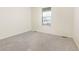 Empty bedroom with carpeted floors and a window at 757 Cabot Dr, Erie, CO 80516