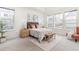 Well-lit bedroom offers carpeted floors and large windows at 757 Cabot Dr, Erie, CO 80516