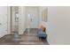 Inviting entryway with wood flooring, a bench, and a view into other rooms at 757 Cabot Dr, Erie, CO 80516