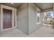 Covered front porch featuring a modern front door and ample space at 757 Cabot Dr, Erie, CO 80516