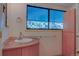 Bright bathroom featuring a vanity with solid surface counter, modern sink and fixtures, and updated cabinetry for ample storage at 1172 Juniper Ave, Boulder, CO 80304