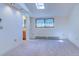 Bright bedroom features neutral carpet, a skylight, and a large window for natural light at 1172 Juniper Ave, Boulder, CO 80304