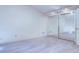 Bright bedroom features neutral carpet, mirrored closet doors, and track lighting at 1172 Juniper Ave, Boulder, CO 80304