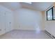 Clean bedroom features neutral carpet, a window, and door leading out of the room at 1172 Juniper Ave, Boulder, CO 80304