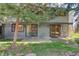 Charming home exterior features a patio, mature tree, and well-maintained lawn at 1172 Juniper Ave, Boulder, CO 80304