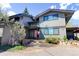 Contemporary gray home with well-maintained landscaping and prominent for sale sign out front at 1172 Juniper Ave, Boulder, CO 80304