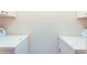 Laundry room featuring a side-by-side washer and dryer with overhead cabinets at 1172 Juniper Ave, Boulder, CO 80304