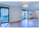 Open living area with wood floors, sliding glass doors offering backyard views, and overhead lighting at 1172 Juniper Ave, Boulder, CO 80304
