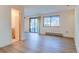 Bright living room with hardwood floors, sliding glass doors, and a bathroom access at 1172 Juniper Ave, Boulder, CO 80304