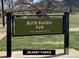 Close-up of a North Boulder Park sign, showcasing the nearby park's location and amenities at 1172 Juniper Ave, Boulder, CO 80304