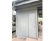 Exterior view of gray storage with a closed door, a gray car, and green foliage visible at 1172 Juniper Ave, Boulder, CO 80304