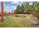 Beautiful backyard with tiered landscaping, lush green lawn, and a sturdy wooden fence at 10969 Valleybrook Cir, Highlands Ranch, CO 80130