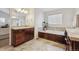 Bathroom boasts a soaking tub with dark wood cabinets and tiled floor at 10969 Valleybrook Cir, Highlands Ranch, CO 80130