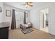 Bedroom with a cozy twin bed, soft rug, and ample natural light at 10969 Valleybrook Cir, Highlands Ranch, CO 80130