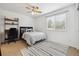 Bedroom with neutral colored rug and a comfy bed next to a black desk at 10969 Valleybrook Cir, Highlands Ranch, CO 80130