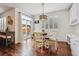 Bright dining area featuring a round table, chairs, and sliding glass doors to the backyard at 10969 Valleybrook Cir, Highlands Ranch, CO 80130