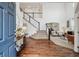 Grand foyer with high ceilings, hardwood floors, and a staircase leading to the upper level at 10969 Valleybrook Cir, Highlands Ranch, CO 80130