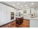 Modern kitchen featuring white cabinets, stainless steel appliances, and a center island at 10969 Valleybrook Cir, Highlands Ranch, CO 80130