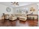 Comfortable living room featuring a large sectional sofa, natural light, and stylish decor at 10969 Valleybrook Cir, Highlands Ranch, CO 80130