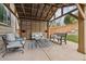 Covered patio with outdoor seating, a decorative rug, and a view of the landscaped backyard at 10969 Valleybrook Cir, Highlands Ranch, CO 80130
