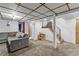 Finished basement space featuring a cozy seating area and a staircase leading to the upper levels at 1732 Lansing St, Aurora, CO 80010
