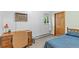 Cozy bedroom with desk, window, and comfortable bed at 1732 Lansing St, Aurora, CO 80010