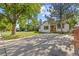 Charming single-Gathering home featuring a wood accent front door, landscaped yard, and a concrete driveway at 1732 Lansing St, Aurora, CO 80010