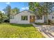 Inviting single-Gathering home showcasing mature trees and a verdant front lawn, enhancing curb appeal at 1732 Lansing St, Aurora, CO 80010