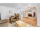 Open living room flows into a modern kitchen, showcasing the home's layout and design at 1732 Lansing St, Aurora, CO 80010