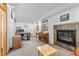 Home office featuring a modern desk setup, slate fireplace, and bright window views at 1732 Lansing St, Aurora, CO 80010