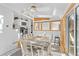 Bright sunroom featuring skylights, dining area, and views of the kitchen at 1732 Lansing St, Aurora, CO 80010