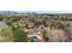 Aerial view of Hermitage townhomes with pool, mature landscaping, and tree-lined streets at 6001 S Yosemite St # F207, Greenwood Village, CO 80111