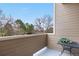 Balcony featuring natural light with open-air views and a small table that highlights outdoor living at 6001 S Yosemite St # F207, Greenwood Village, CO 80111