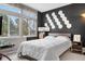 Bedroom with large window and unique accent wall for design at 6001 S Yosemite St # F207, Greenwood Village, CO 80111