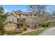 Charming multi-story townhome exterior featuring brick accents, cozy patios, and scenic walkways at 6001 S Yosemite St # F207, Greenwood Village, CO 80111