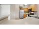 Efficient kitchen features stainless steel appliances, light wood cabinetry and breakfast bar at 6001 S Yosemite St # F207, Greenwood Village, CO 80111