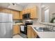 Modern kitchen featuring stainless steel appliances and ample counter space at 6001 S Yosemite St # F207, Greenwood Village, CO 80111